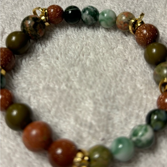 Earthtone beaded bracelet with gold tone spacers. 9” with stretch. Like new - Picture 2 of 2